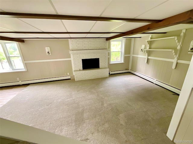 3615 N Mill Rd, Dryden, MI 48428 - unfurnished living room featuring baseboard heating, wainscoting, beamed ceiling, a fireplace, and carpet flooring