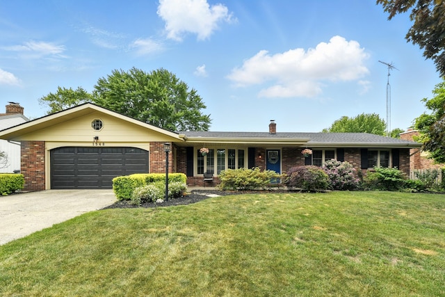 1548 Old Hickory Ln, Saint Joseph, MI 49085 - ranch-style home with brick siding, a garage, a chimney, concrete driveway, and a front yard