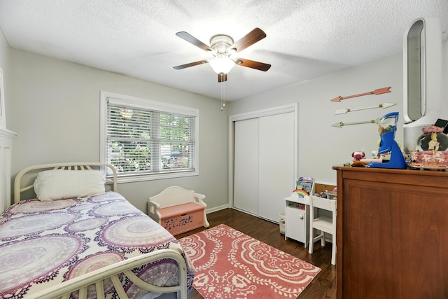 1548 Old Hickory Ln, Saint Joseph, MI 49085 - bedroom featuring wood finished floors, a closet, a ceiling fan, and a textured ceiling
