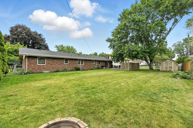 1548 Old Hickory Ln, Saint Joseph, MI 49085 - view of yard featuring a storage shed and a fire pit