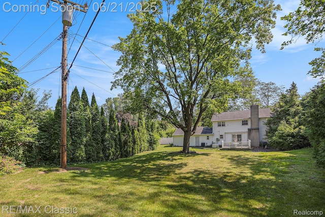 1925 Dawn Ridge Rd, Commerce Twp, MI 48390 - view of green lawn with a wooden deck
