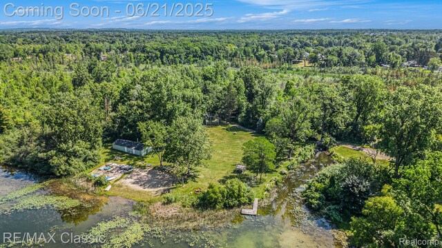 1925 Dawn Ridge Rd, Commerce Twp, MI 48390 - aerial view of property and surrounding area with a heavily wooded area