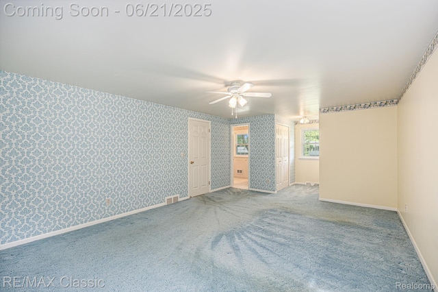 1925 Dawn Ridge Rd, Commerce Twp, MI 48390 - carpeted empty room with a ceiling fan and wallpapered walls