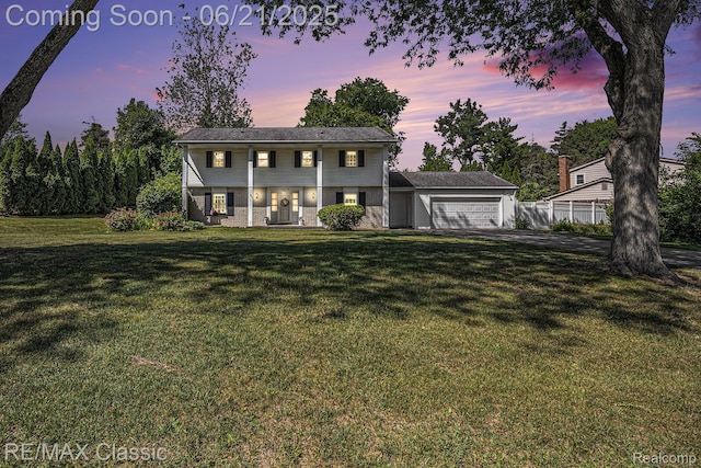 1925 Dawn Ridge Rd, Commerce Twp, MI 48390 - colonial house featuring a garage, brick siding, and driveway