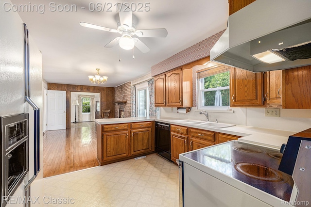 1925 Dawn Ridge Rd, Commerce Twp, MI 48390 - kitchen featuring exhaust hood, white range with electric cooktop, brown cabinetry, black dishwasher, and a peninsula