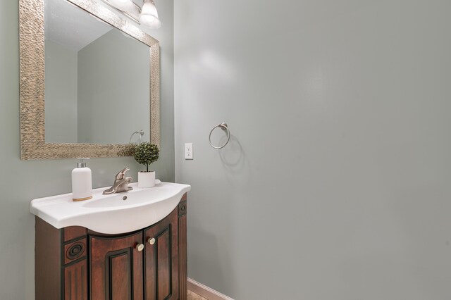 13421 Woodland Ct, Big Rapids, MI 49307 - bathroom featuring vanity