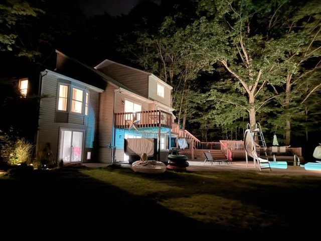 13421 Woodland Ct, Big Rapids, MI 49307 - playground at night with a deck