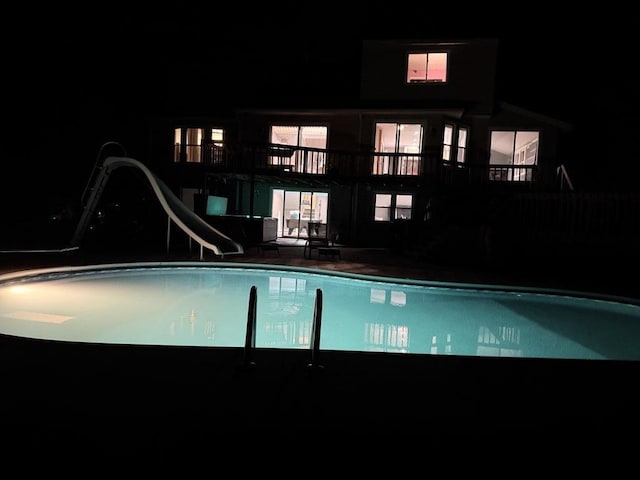 13421 Woodland Ct, Big Rapids, MI 49307 - pool at twilight featuring a water slide