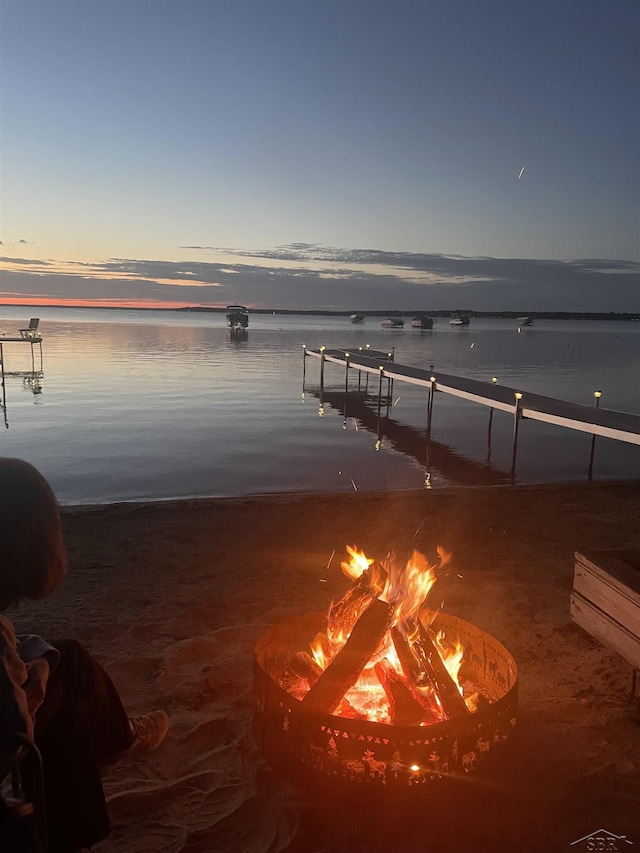 578 W Houghton Lake Dr, Prudenville, MI 48651 - dock area with an outdoor fire pit and a water view