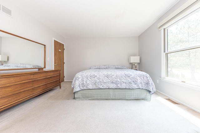 492 Colin Cir, Ann Arbor, MI 48103 - carpeted bedroom featuring multiple windows