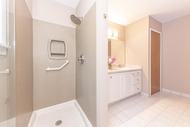 492 Colin Cir, Ann Arbor, MI 48103 - bathroom featuring tiled shower, vanity, and tile patterned floors