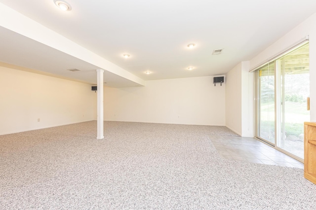 492 Colin Cir, Ann Arbor, MI 48103 - below grade area featuring light carpet and baseboards