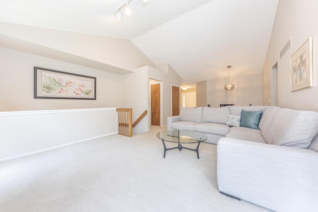 492 Colin Cir, Ann Arbor, MI 48103 - living room featuring lofted ceiling, light colored carpet, and rail lighting