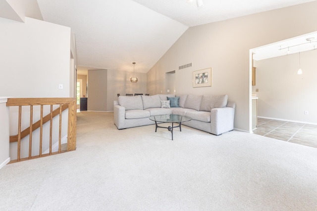 492 Colin Cir, Ann Arbor, MI 48103 - carpeted living area with vaulted ceiling and a chandelier