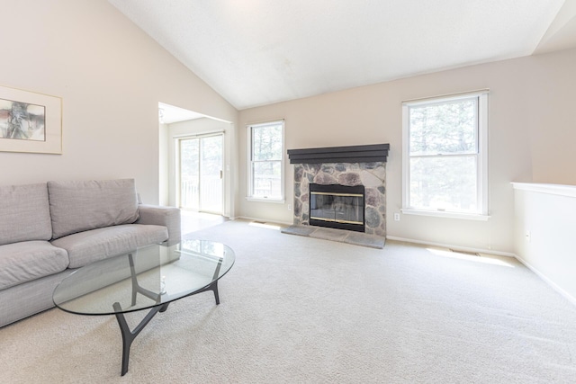 492 Colin Cir, Ann Arbor, MI 48103 - carpeted living room featuring healthy amount of natural light, lofted ceiling, and a fireplace