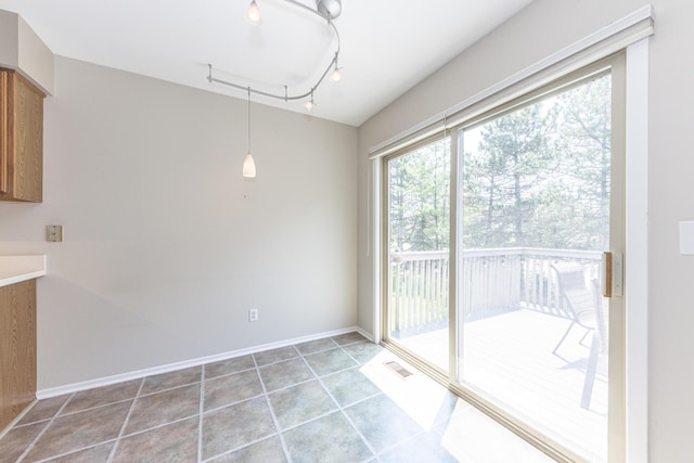 492 Colin Cir, Ann Arbor, MI 48103 - unfurnished dining area with light tile patterned floors