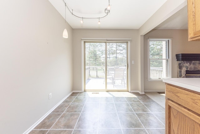 492 Colin Cir, Ann Arbor, MI 48103 - entryway with a fireplace and light tile patterned floors