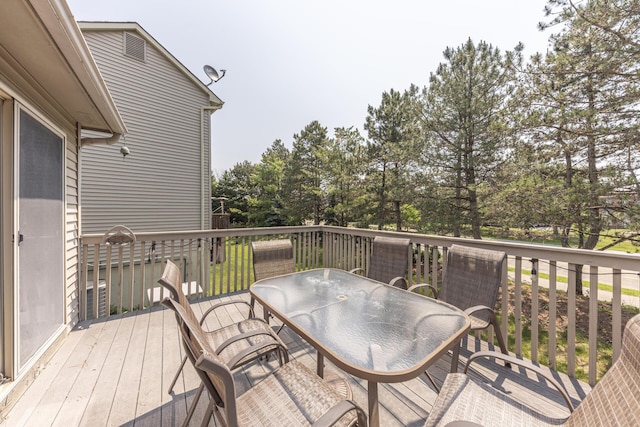 492 Colin Cir, Ann Arbor, MI 48103 - wooden terrace with outdoor dining area and view of wooded area