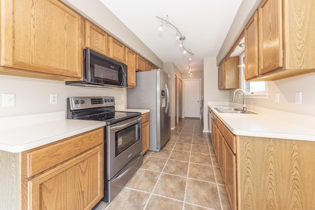 492 Colin Cir, Ann Arbor, MI 48103 - kitchen with stainless steel electric range, black microwave, light countertops, and light tile patterned floors