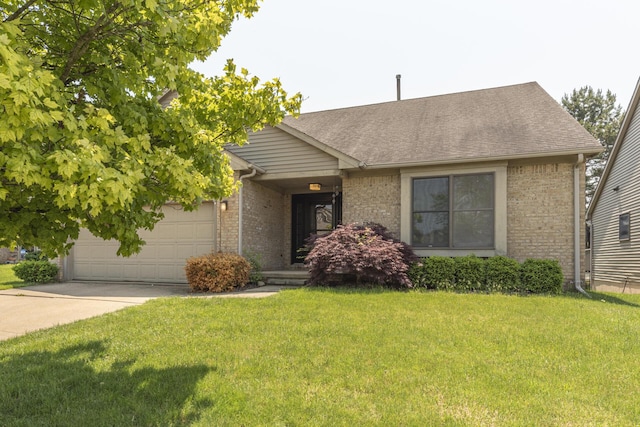 492 Colin Cir, Ann Arbor, MI 48103 - view of front of property with driveway, brick siding, a garage, a front yard, and a shingled roof