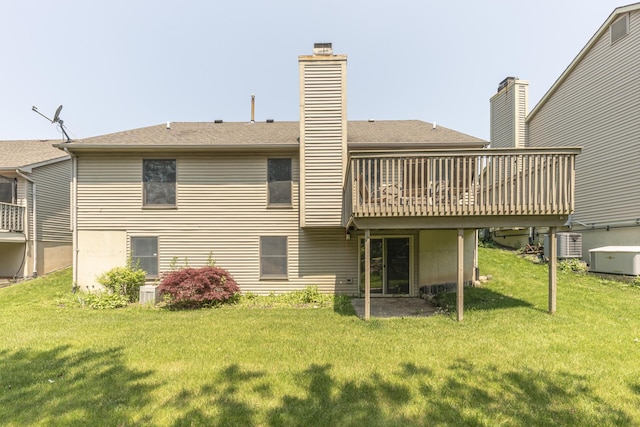 492 Colin Cir, Ann Arbor, MI 48103 - rear view of house featuring a lawn, a wooden deck, a chimney, and a shingled roof