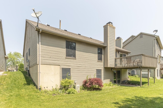 492 Colin Cir, Ann Arbor, MI 48103 - back of house with a lawn, a wooden deck, and a chimney