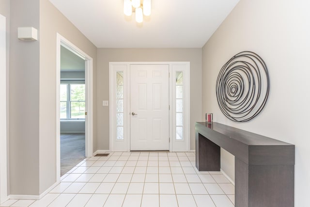 492 Colin Cir, Ann Arbor, MI 48103 - foyer entrance featuring baseboards and light tile patterned floors