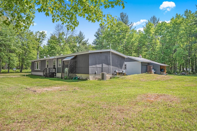 283 W 16th St, Baldwin, MI 49304 - view of side of property with a yard