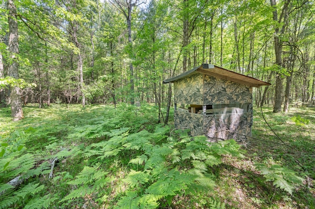283 W 16th St, Baldwin, MI 49304 - view of outdoor structure with a wooded view