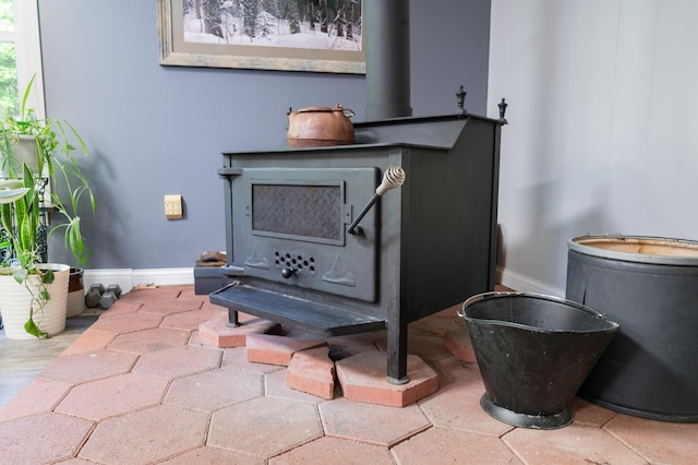283 W 16th St, Baldwin, MI 49304 - detailed view of a wood stove and baseboards