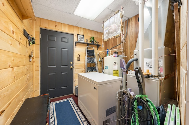 283 W 16th St, Baldwin, MI 49304 - washroom with wood walls and water heater
