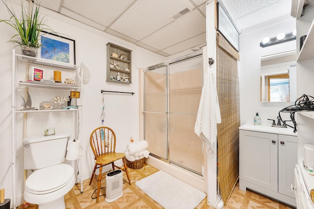 283 W 16th St, Baldwin, MI 49304 - full bathroom with a stall shower, vanity, and a drop ceiling