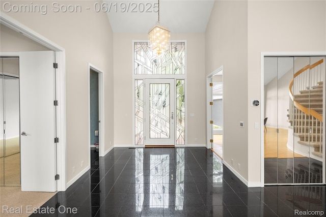 2505 Cedar Key Dr, Lake Orion, MI 48360 - foyer entrance with a towering ceiling, granite floors, and a chandelier