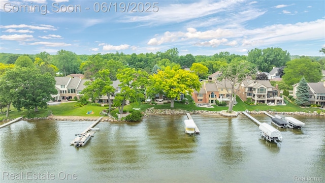 2505 Cedar Key Dr, Lake Orion, MI 48360 - water view with nearby suburban area and a boat dock