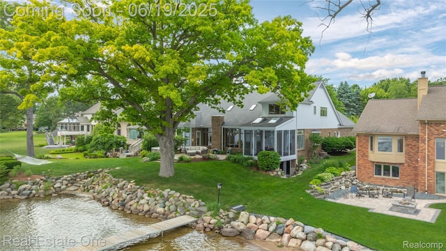 2505 Cedar Key Dr, Lake Orion, MI 48360 - view of green lawn with a patio and a sunroom