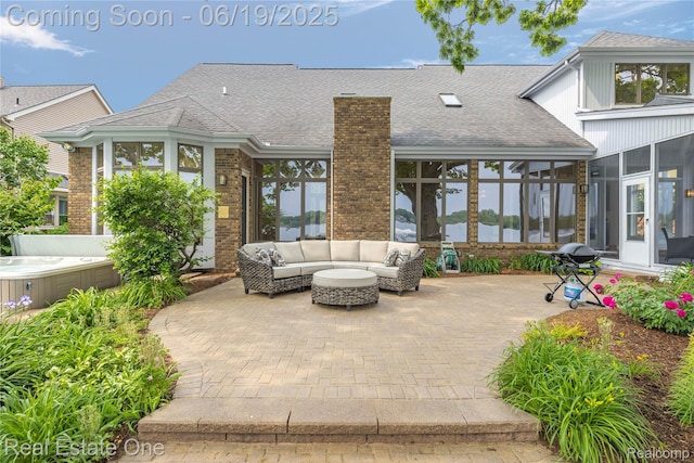 2505 Cedar Key Dr, Lake Orion, MI 48360 - view of patio featuring a sunroom, a hot tub, an outdoor living space, and a grill