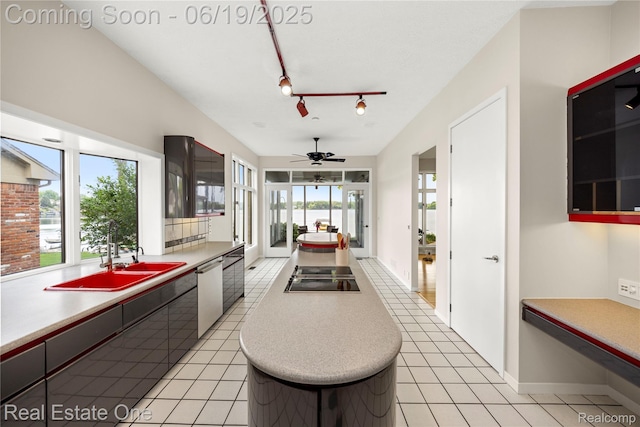 2505 Cedar Key Dr, Lake Orion, MI 48360 - kitchen with black electric cooktop, dishwasher, a center island, ceiling fan, and light countertops