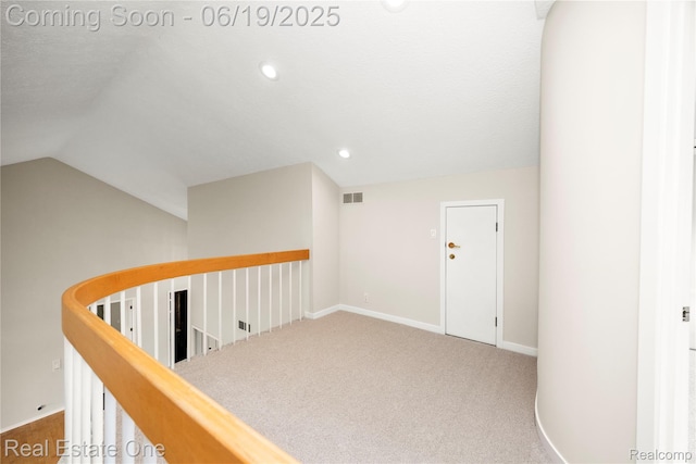2505 Cedar Key Dr, Lake Orion, MI 48360 - hall featuring an upstairs landing, vaulted ceiling, carpet flooring, and recessed lighting