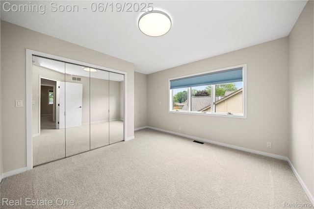 2505 Cedar Key Dr, Lake Orion, MI 48360 - unfurnished bedroom featuring carpet floors and a closet