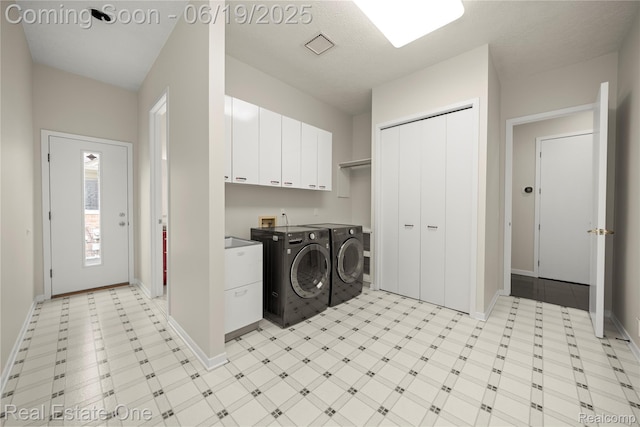 2505 Cedar Key Dr, Lake Orion, MI 48360 - laundry room with cabinet space, separate washer and dryer, and light floors