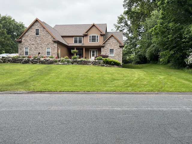 5374 Autumn Ct, Kalamazoo, MI 49009 - craftsman-style home with stone siding and a front lawn