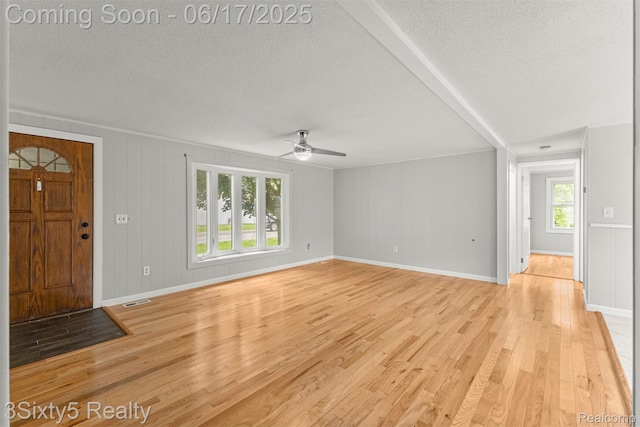 36513 Evans St, New Boston, MI 48164 - entryway featuring a textured ceiling, light wood finished floors, and ceiling fan
