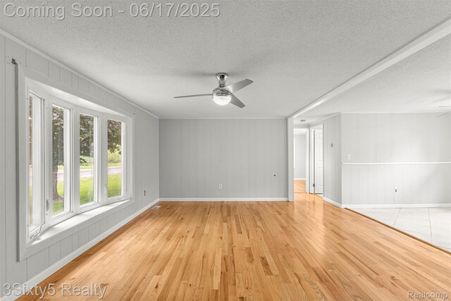 36513 Evans St, New Boston, MI 48164 - unfurnished room with ceiling fan, light wood-style flooring, and a textured ceiling