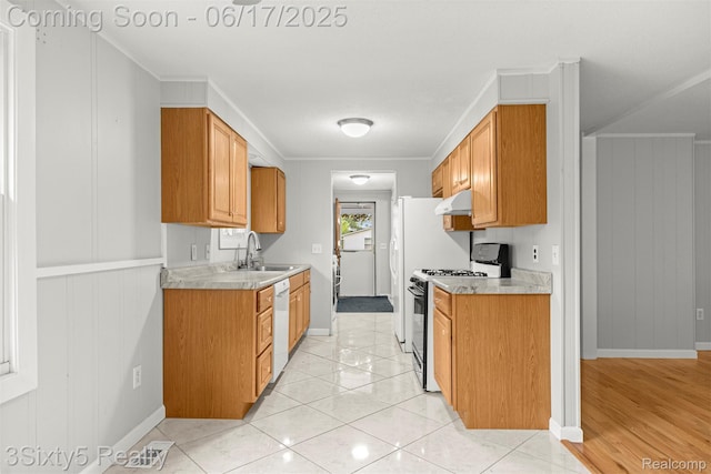 36513 Evans St, New Boston, MI 48164 - kitchen featuring gas stove, under cabinet range hood, light countertops, dishwasher, and ornamental molding