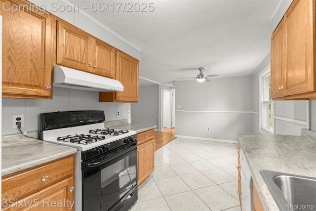 36513 Evans St, New Boston, MI 48164 - kitchen featuring range with gas stovetop, under cabinet range hood, a ceiling fan, light countertops, and a textured ceiling