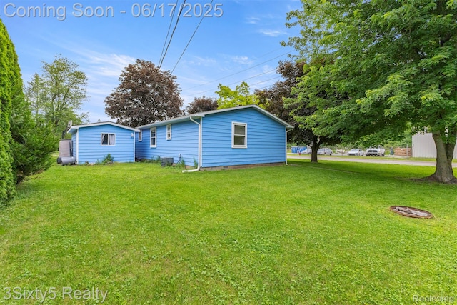 36513 Evans St, New Boston, MI 48164 - back of house with a lawn