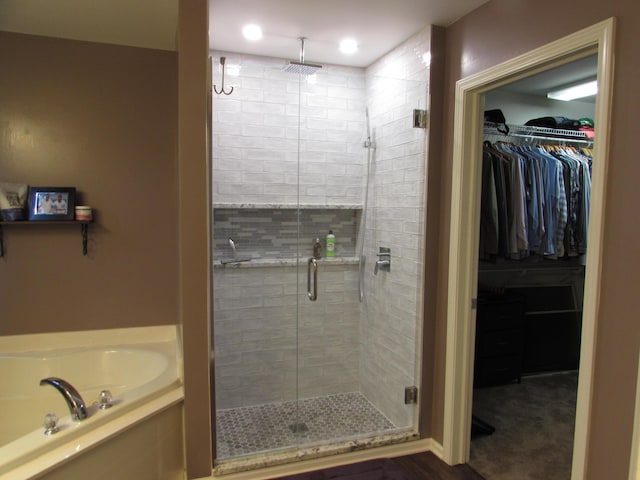 1995 Frances Way, Ypsilanti, MI 48198 - bathroom with a stall shower, a garden tub, and a spacious closet