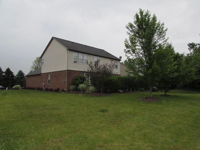 1995 Frances Way, Ypsilanti, MI 48198 - view of home's exterior featuring a yard and brick siding