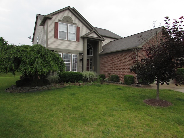 1995 Frances Way, Ypsilanti, MI 48198 - view of front facade with a front lawn and brick siding