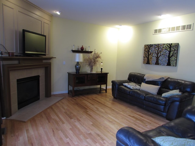 1995 Frances Way, Ypsilanti, MI 48198 - living area featuring light wood-type flooring and a tiled fireplace